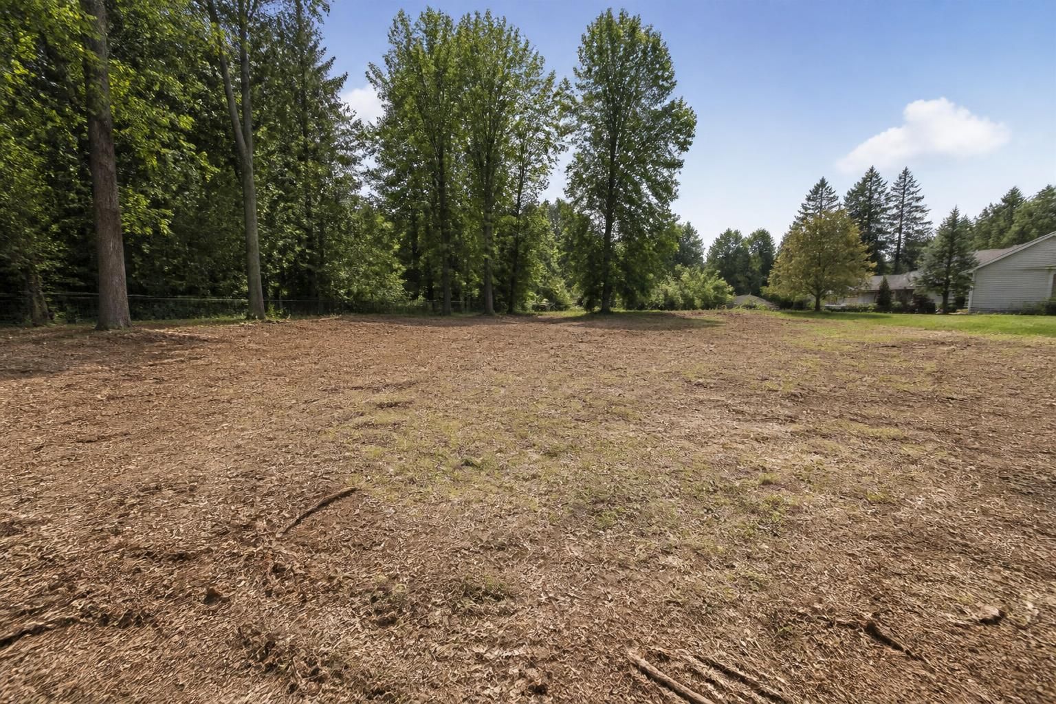 Freshly cleared residential lot with a neat open yard